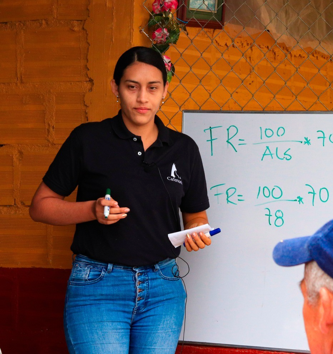 Colombian farmer teaching class.